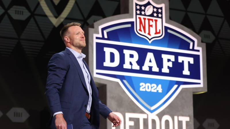 NFL Commissioner Roger Goodell walking on stage at the NFL Draft in Detroit.